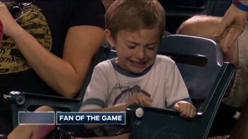 Kid struggles to crack peanut at Twins-Angels game